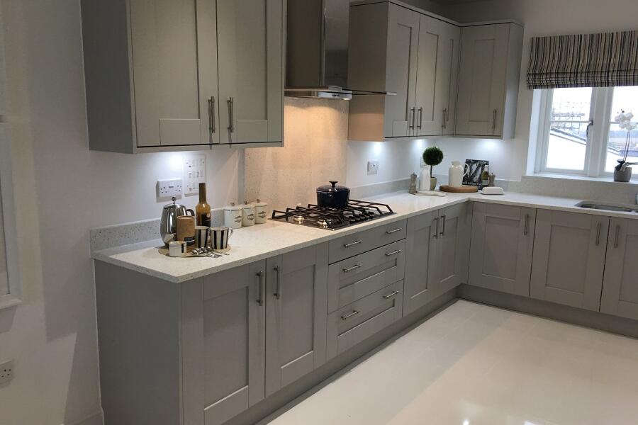 Grey Cabinets with white kitchen quartz worktops